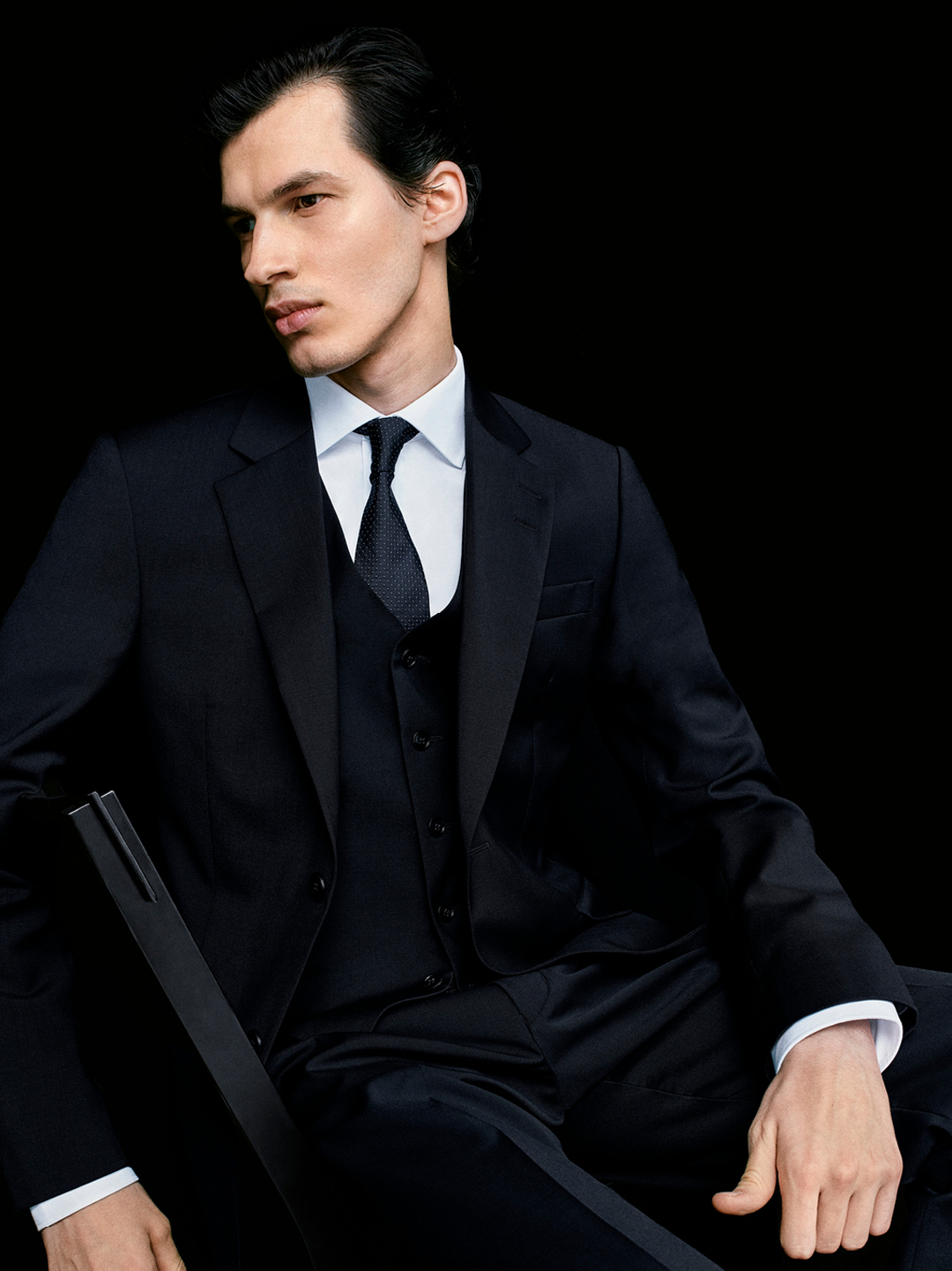 Man in blue shirt and suit jacket